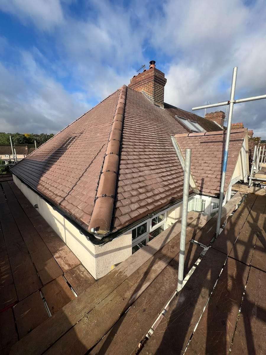Re tiled hipped clay roof, by The Rockin' Roofer Ltd